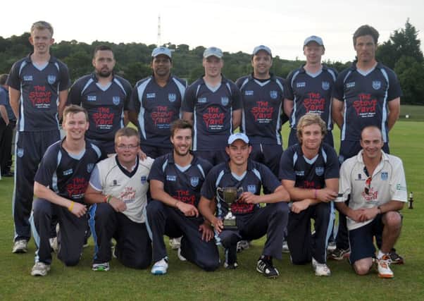 Carrickfergus Cricket Clubs 1st X with the first of their four titles in 2014 - the Lagan Valley Steels Twenty20 trophy. INCT 30-105-GR