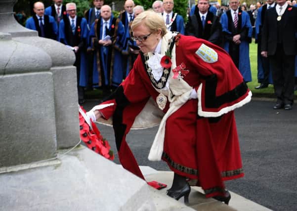 Mayor of Ballymena, Cllr. Audrey Wales, laying a wreath at the cenotaph in the Memorial Park. INBT46-224AC