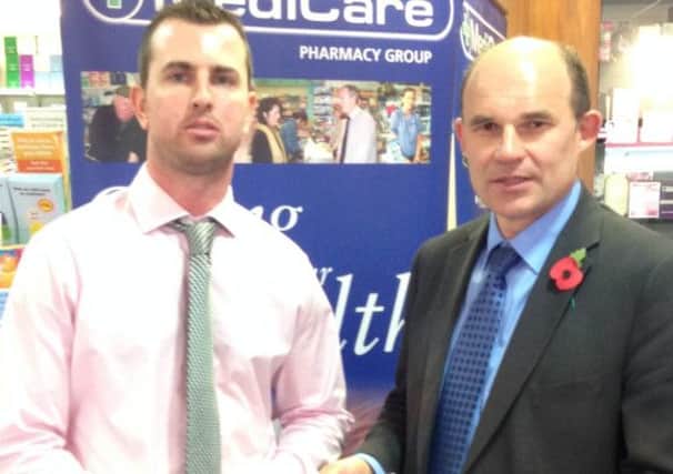 East Antrim MLA Roy Beggs (right) with Matthew McWilliams, community pharmacist with MediCare, at the Victoria Road premises. INCT 46-793-CON