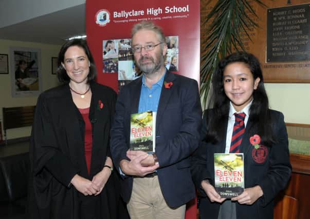 Author Paul Dowswell with English teacher Elizabeth McConnell and pupil Kaye-Ann Geronimo.