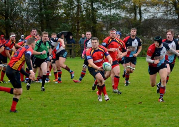 Ballyclare's scrum-half Colin Morrow mounts an attack in Saturday's victory over Belfast Harlequins II. INNT 46-147-GR