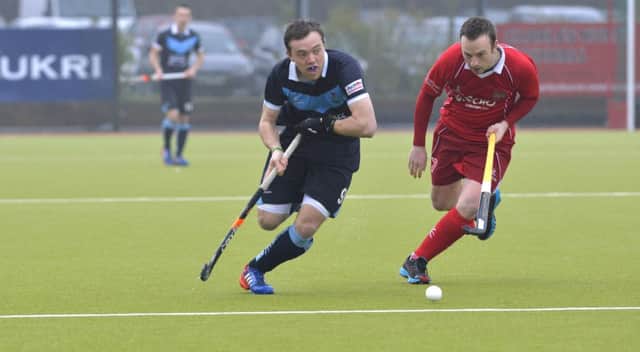 Mandatory Credit: ROWLAND WHITE / PRESSEYE
Men's Irish Hockey League
Teams: Lisnagarvey (blue) v Cookstown (red)
Venue: Lisnagarvey
Date: 29th March 2014
Caption: Andy Williamson, Lisnagarvey and Ewan Butler, Cookstown