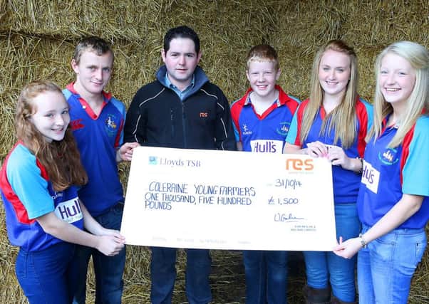 RES representative Karl O'Mullan presents a cheque for £1,500 to members of the Coleraine Young Farmers' Club, which will help to rebuild their groups premises in the town. Included on behlaf of the young farmers are Maxine Smyth, Russell Smyth, Paul Adams, Joanne Smyth and Ruth Adams.