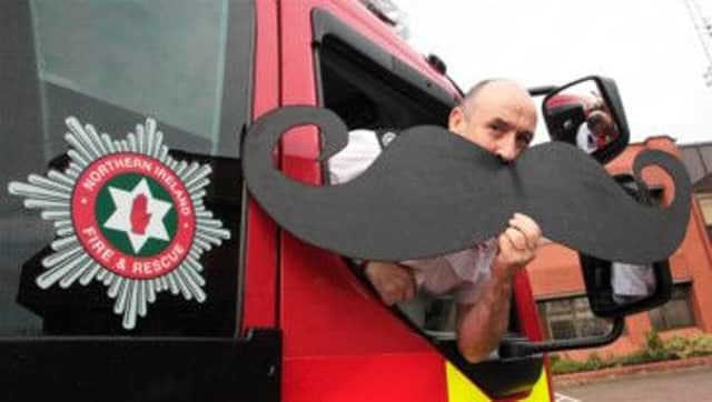 Group Commander Keith Black is one of 50 NIFRS Firefighters and Support Staff on a razor sharp mission Growing the Mo to support the Mens Health Campaign Movember .