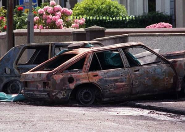 The burnt out car in which three IRA men were shot dead by the SAS in Coagh in 1991.