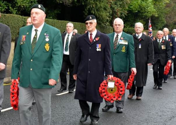 Parading through Cullybackey during the village's Remembrance Day Service. INBT46-238AC