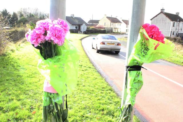 Flowers at the scene in Cloughmills were 8-year old Adam Gilmour was killed on Monday morning on route to school.PICTURE MARK JAMIESON. INBM47-14 MJ