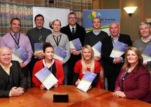 Town Clerk and Chief Executive officer Sharon OConnor (seated, right). with  council employees who received their NEBOSH Health & Safety certificates, in a ceremony at the Derry City Council offices. From left (seated) are course tutor, Jim Donnelly, with JMD Training,  Shona McClenaghan, and  Teresa Bradley.  Standing, Eunan McCarron, Jayson McIntyre, Alan Ross, Keith Ferguson, Adrian Boyle, Mark Crystal and Leo Strawbridge.  4614-2376MT.