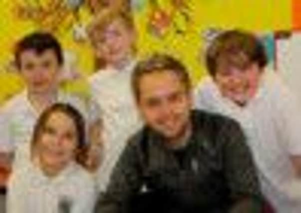 Derek Ryan with Cookstown Primary School pupils