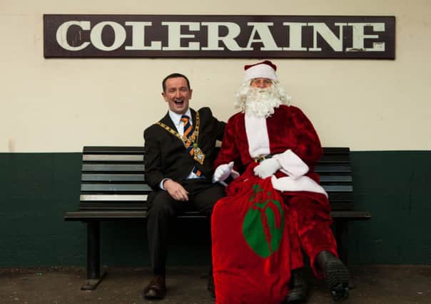 The Mayor of Coleraine, Councillor George Duddy meets Santa from the train as he stops to take a sneak preview of the lights prior to switch on of Coleraines lights on Friday, November 28.