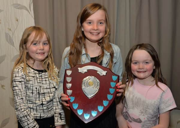 Amy O`Cleary is pictured with sisters, Grace and Lucy after winning the Albert Tipple Memorial Shield for Best Handler at the Mounthill Fair Society annual awards night at St Johns Masonic Centre. INLT 46-008-PSB