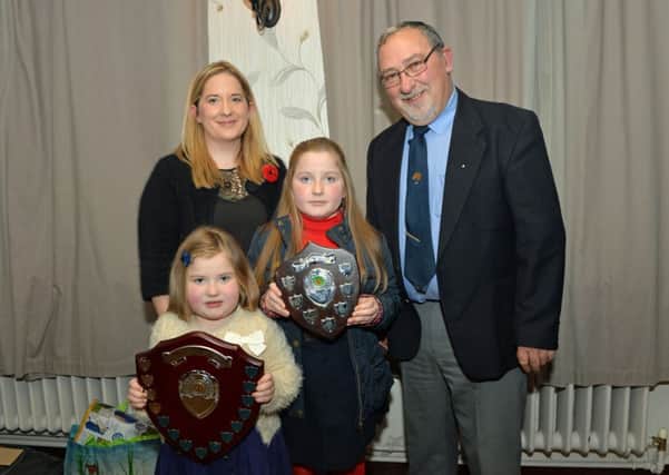 John Cross, Chairman of the Mounthill Fair Society is pictured with Charlotte McAllister who picked up the Firgrove Stables Trophy and the Mounthill Champion of Champions Trophy with mum, Lucy and sister Sophie at the Mounthill Fair Society annual awards night. INLT 46-010-PSB