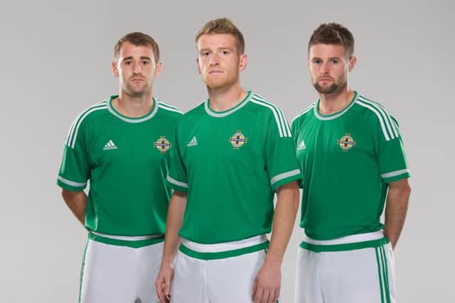 Trio Niall McGinn, Steven Davis and Oliver Norwood pictured in the new Northern Ireland strip.