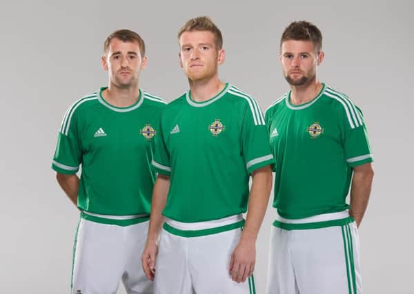 Trio Niall McGinn, Steven Davis and Oliver Norwood pictured in the new Northern Ireland strip.