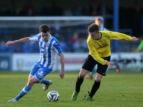 Coleraine's Shane McGinty in action against Dungannon's Jamie Tomelty. Pic by John McIwaine-Press Eye