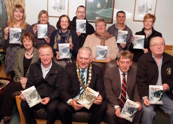 SCHOOL OF KNOWLEDGE. Pictured at the launch of the First World War School Project on Thursday at Riada House along with Mayor Cllr Billl Kennedy are members from the Ballymoney & District Cultural & Heritage Society, Sammy McClements, Noel Anderson, Jack Anderson, Heather Anderson, Ivan Morrow, Irene Stewart, Craig Beldrey and Jackie Black along with Angela Mulholland and Lyn McAfee from Ballymoney Community Resource Centre. Also included is Corporate Services Manager, Liz Johnston.INBM47-14 061SC.