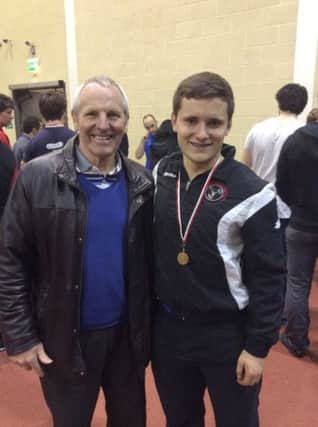 Jamie received his gold medal from Lawrence McConnell.