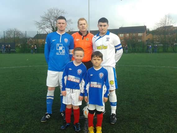 Banbridge Rangers Matchday mascots Jack Cochrane and Finlay Whitten from the clubs Under Seven team alongside Colin Cousins (Banbridge Rangers Captain), Referee Alan Hayes and Christopher McMaho ( Newry City AFC Captain).
