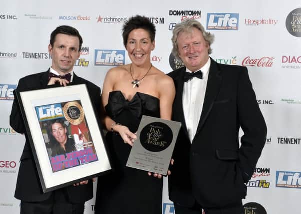 Martin Breen, editor, Sunday Life, Clare Johnston from The Railway Arms in Coleraine and Ivan Little, Sunday Life pictured at Pubs of Ulsterâ¬"s prestigious Pub of the Year Awards 2014, where the Clare won the Best Barperson Award in association with Sunday Life.   In addition to its big win, The Railway Arms was shortlisted for the overall Pub of the Year Award. The Awards night, hosted by Cool FM Breakfast Show Host, Pete Snodden, was attended by the best in the hospitality business and was held at the La Mon Hotel and Country Club on Wednesday 12th November 2014. The annual Pub of the Year Awards are the only industry recognised awards and provide a valuable opportunity to recognise the significant contribution local pubs make, not only within their own communities, but to the industry as a whole. This yearâ¬"s awards were sponsored by Britvic, Coca-Cola, Diageo, Dillon Bass, Heineken Northern Ireland, Molson Coors, Richmond Marketing, Tennentâ¬"s NI, Drinks Inc. and media partners, Sunday Life, Downtown/C