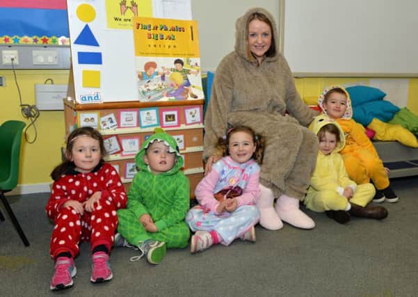 Corran Integrated Primary School P1 teacher, Mrs Rogers is pictured with Imogen, Slaine, Francesca, Lana and Cain during their Children in Need fundraising day. INLT 47-006-PSB