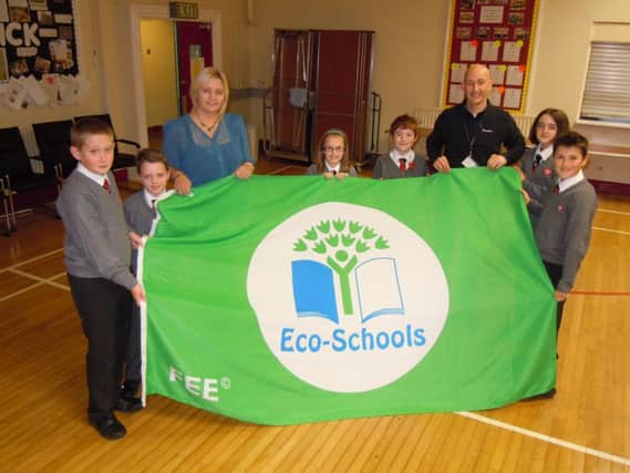 Eden Primary School proudly unfurls the prestigious Eco-Schools Green Flag Award.  INCT 47-753-CON EDEN