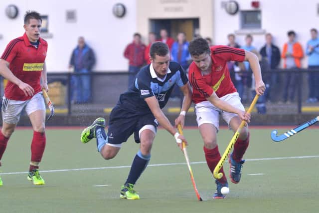 Garvey's Jonny Bell takes on Corinthians' Dan Tracey. Pic by Rowland White / PressEye