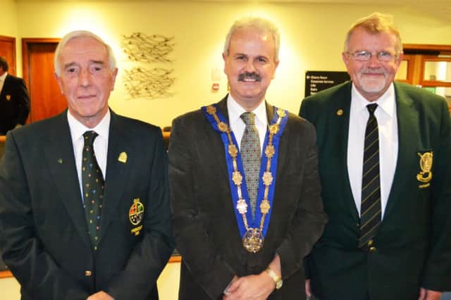 Ivor McCandless with Lisburn Deputy Mayor Cllr. Thomas Beckett and Peter Cairns Captain of Lisburn at the recent reception to commemorate his year as GUI President.