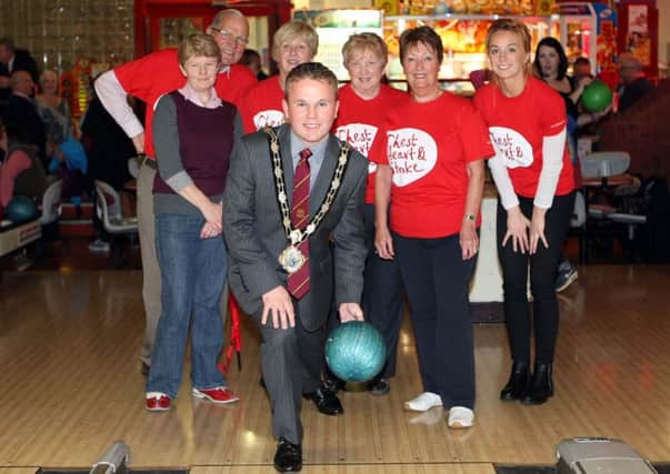Mayor Thomas Hogg joined David Magill (chairman) and members of the NI Chest Heart and Stroke Glengormley Support Group at their 25th annual ten pin bowling competition, held at the Sportsbowl, Glengormley. INNT 44-537CON