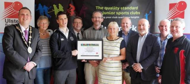 Mayor Andrew Ewing looks on as Declan Steele, third from left, Sport NI club development consultant, presents members of Lisburn Racquets Club with a Clubmark NI accreditation award for effective management, quality coaching and competition safety in sport. US1444-505cd  Picture: Cliff Donaldson
