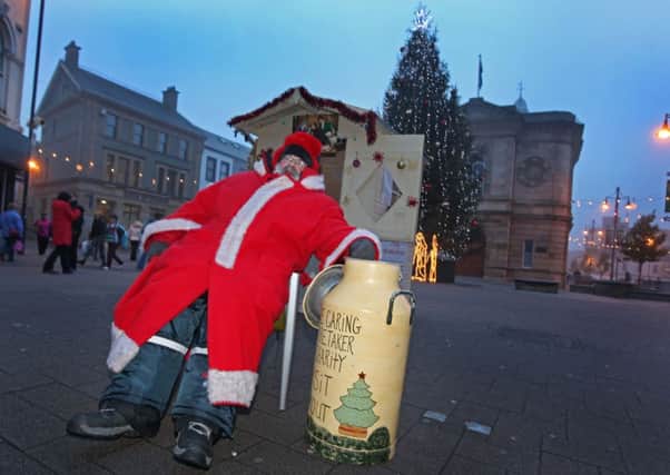 Tuesday 18th December..Coleraine Caring Caretaker David Boyle on the street in Coleraine during his Christmas Sit Out for Charity, David has raised over £300,00 over the years.. Pic Steven McAuley/Kevin McAuley Photography Multimedia