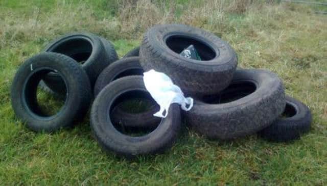 The unsightly mess after tyres appear to have been dumped on the Pharis Road near Loughgiel. inbm48-14s
