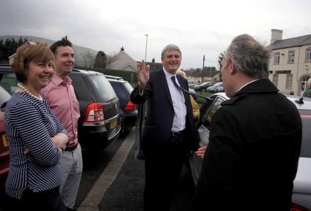 Jim Wells Minister for Healt visited Dalriada Hospital pictured on Friday morning where he spent a full hour touring the facilities before a decision is made on closure or the future of the hospital at the start of the week. He is pictured waving to protestors with Ian Paisley MP for North Antrim Dr Mary McLister and Dr Feargal Hasson. PICTURE KEVIN MCAULEY/MCAULEY MULTIMEDIA