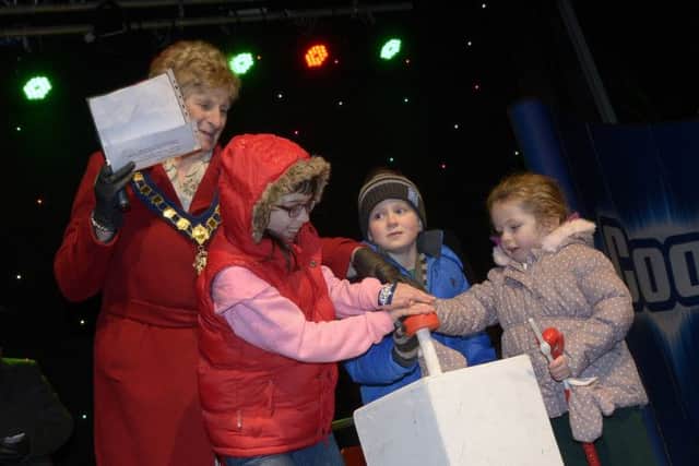 Banbridge District Council Chairman Cllr Olive Mercer enlisted the help of Anna, Lucy and Dylan to switch on the Christmas Lights in Banbridge  © Edward Byrne Photography INBL49-234EB