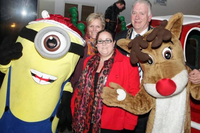 ONE IN A MINION. Mayor Cllr Bill Kennedy, Mayoress Sandra Stirling and Cllr Roma McAfee, pictured along with Minion and Rudolf at the Switch On in Ballymoney on Thursday night.INBM48-14 024SC.