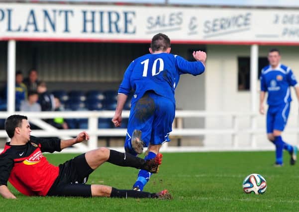 Tobermore's Stuart Glasgow brings down Coagh's Terence O'Brien during Saturday's local derby clash at Hagan Park.INMM4814-414