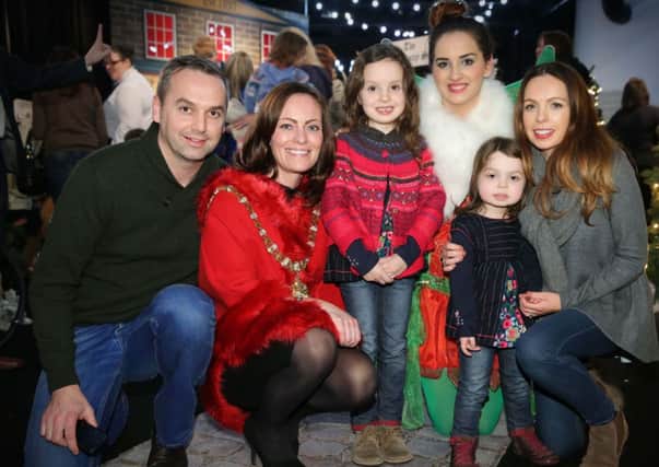 Belfast Lord Mayor Nichola Mallon pictured with the Hendron family from Ballymena at Titanic Belfast's Magical Christmas Experience on Friday night (November 21). The night was organised for families such as the Hendrons, who have received support from local charity Cancer Fund for Children. Pictured with Ms Mallon from left to right are Peter Hendron, Isabella Hendron, the Titanic Belfast Christmas fairy, Matilda Hendron and Emily Hendron.