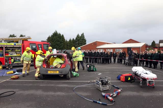 Pupils from Lisburn Schools watch the Emergency Services in action during a collision demonstration.
