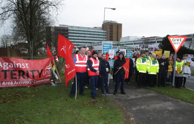 Health workers on picket duty outside Altnagelvin Hospital yesterday morning during a four hour walkout. DER4814MC005