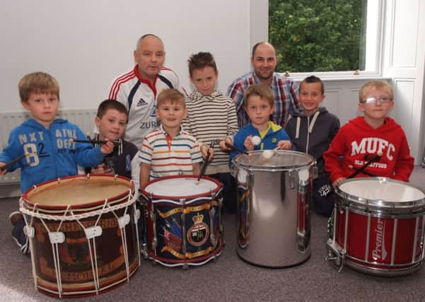 Derek Moore and Gavin Bond, tutors, pictured with some of the youngsters who enjoyed the drumming workshop which was held by the Waterside Bands Forum in St. Columb's Park House during Fleadh Cheoil Na nÉireann 2014. INLS3413-119KM