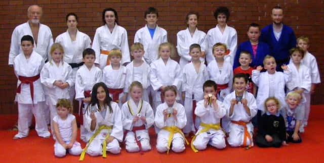 Some of the Coleraine Judo Club Junior Section with FUNdamentals and Red Belt Rumble medalists in the front row sporting their medals (silver medalist Sam Clements is missing). (S)