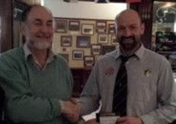 The Plough Inn Man of the Match Award is presented by Robert Pringle to Richard Henning of the Lisburn 3rd XV.
