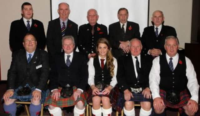 Pictured are officials of the Mid-Ulster Section. Back row, from left: Alan Ferguson, assistant child protection officer; Trevor Wilson, vice-chairman; Malcolm Wilson, assistant treasurer; Sam Glasgow M.B.E., president; Alex Crooks, vice-president.  Front row, from left: Ray Hall, chairman Northern Ireland Branch; Desmond McLaughlin, secretary; Zoe McDowell, world champion; John Gilmour, treasurer; Lowry Ferguson, chairman.