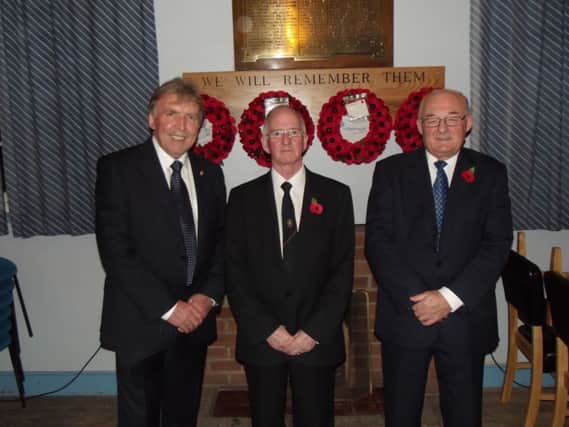 At the Remembrance Service in Ballinderry War Memorial Hall are the Re Bobby Loney, Eddie Carson, hall committee chairman and Humphrey Gardiner, vice-chairman.