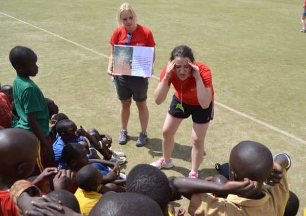 Rebecca Barr, Charlene's sister, doing Malaria prevention work in Uganda.