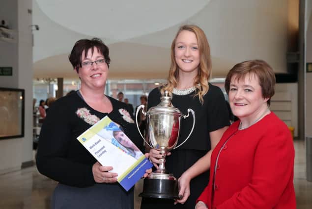 Lyndsey Reid from Carrickfergus is presented with her awards by Danielle McWall (left), course director BSc Accounting and professor Marie McHugh, (right), dean of the Ulster University Business School. INCT 49-701-CON ACCOUNTANCY