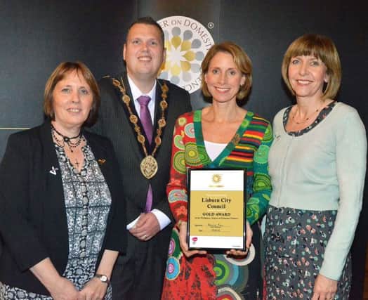Pictured at the recent Onus Annual Awards Ceremony where the Council received its Gold Workplace Charter are: (l-r) Councillor Jenny Palmer, Chair of the Council's Environmental Services Committee; the Mayor of Lisburn, Councillor Andrew Ewing; Sandra Pinion and Brona Turley, Designated Safeguarding Officers, Lisburn City Council.