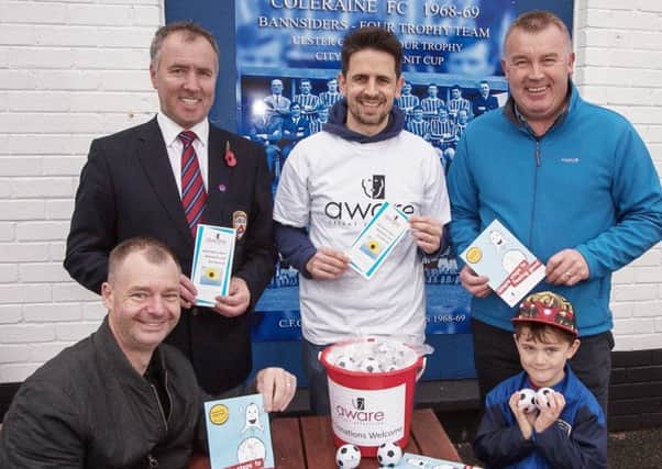 Kieran Hughes of "Aware Defeat Depression" at Coleraine Showground with CFC Chairman Colin McKendry, Academy Chairman Andy Alcorn and Iain McAfee and son Cameron.  One of a series of events during Men's Health Month at Coleraine FC. photo:Derek Simpson