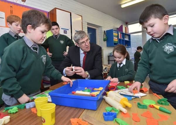 Education Minister John O'Dowd engages with St John's pupils. Photo by Simon Graham/Harrisons