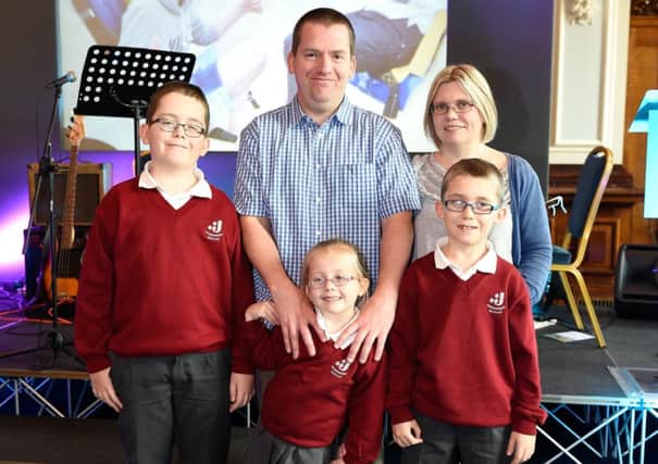 Local family James and Joanne Dickson and their children Ryan, Emma, and Kyle attended the launch of RNIB NI's 'Looking ahead: a parent's guide' on 21 October in Belfast City Hall.  This guide is a roadmap of services for families of children with sight loss. INNT-49-700-con