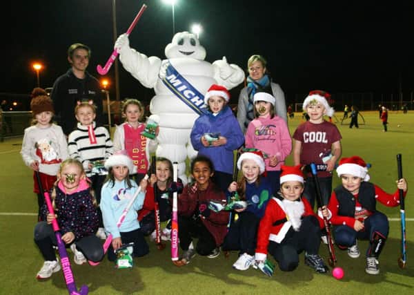 Members of Ballymena Hockey Club minis pictured during their Christmas party with Bibendum, Alan McKnight and Cathy Simpson (Personnel Manager) of Michelin who sponsored the event. INBT49-222AC